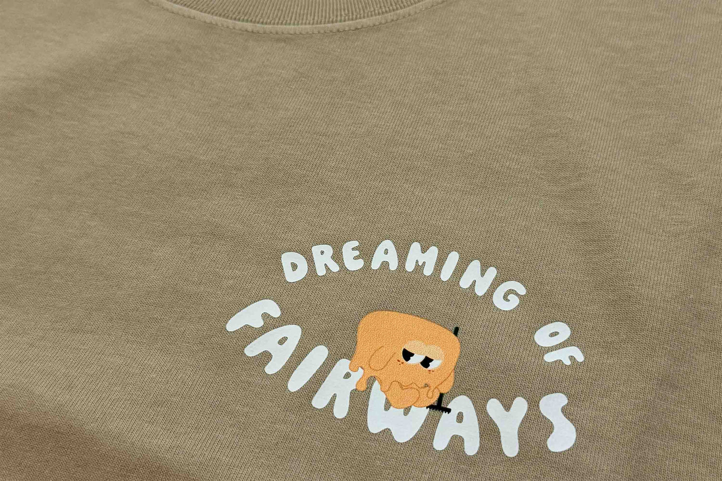"DREAMING OF FAIRWAYS" FADED KHAKI TEE